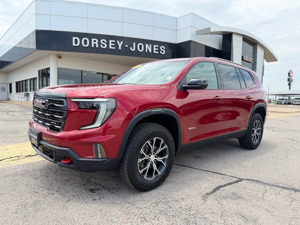 2025 GMC Acadia AT4 in Volcanic Red Tintcoat — front three-quarter view