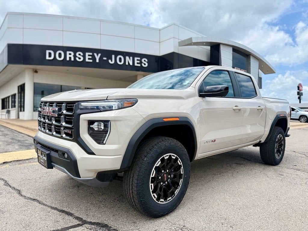 2026 GMC Canyon AT4 in Coastal Dune — front three-quarter view