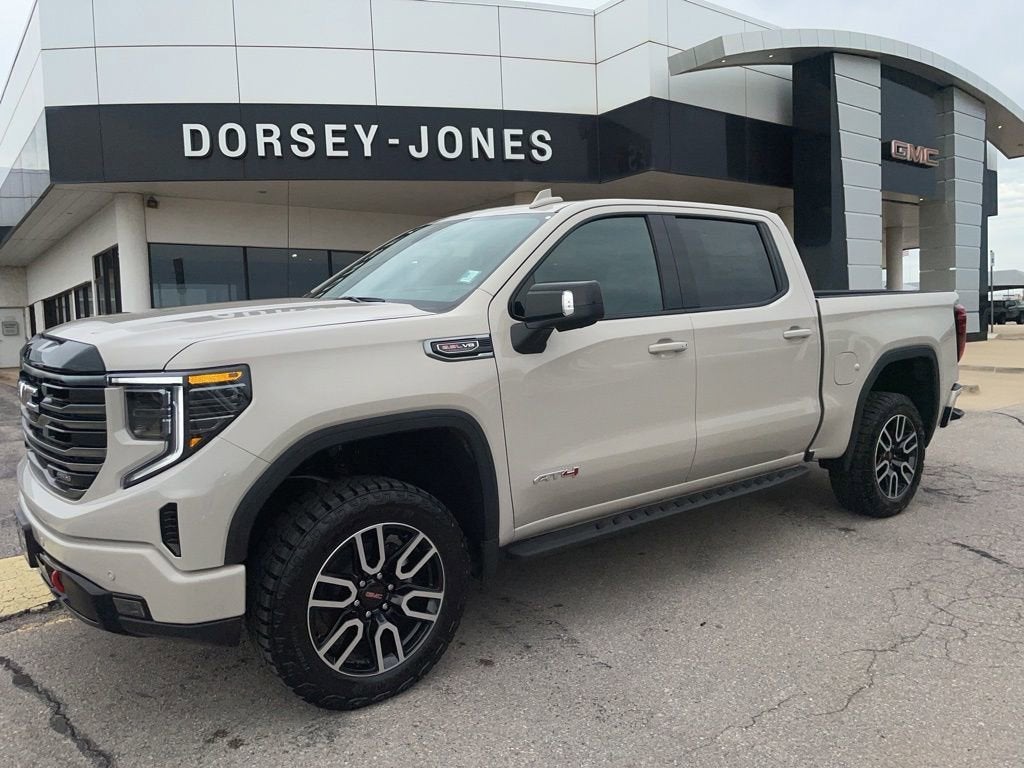 2026 GMC Sierra 1500 AT4 in Coastal Dune — front three-quarter view